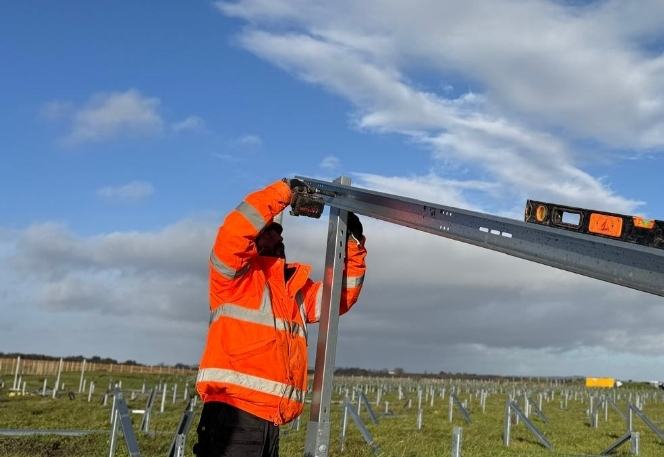 Petroff operative fixing a solar mounting rail